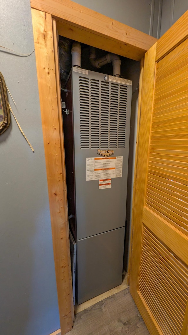detailed view of a heating unit and wood finished floors