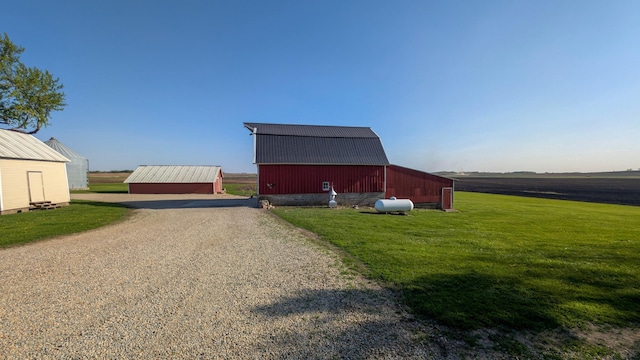view of barn with a yard