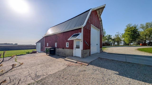 view of outbuilding featuring an outbuilding and driveway