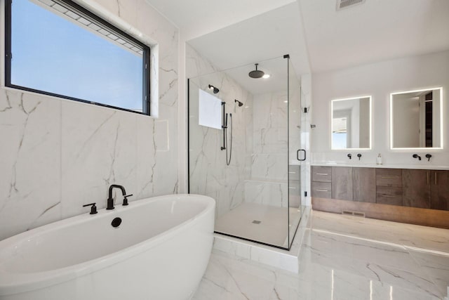 12745 Stutz Ct NE, Blaine, MN 55449 - bathroom with a marble finish shower, a freestanding bath, marble finish floors, and double vanity