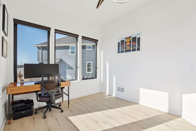 12745 Stutz Ct NE, Blaine, MN 55449 - home office with wood finished floors and baseboards