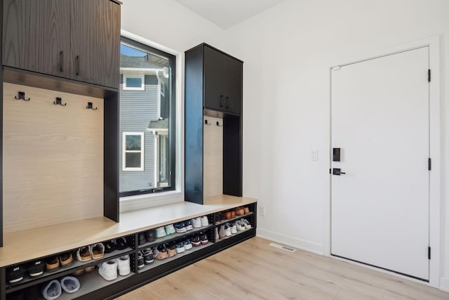 12745 Stutz Ct NE, Blaine, MN 55449 - mudroom featuring light wood-style floors and baseboards