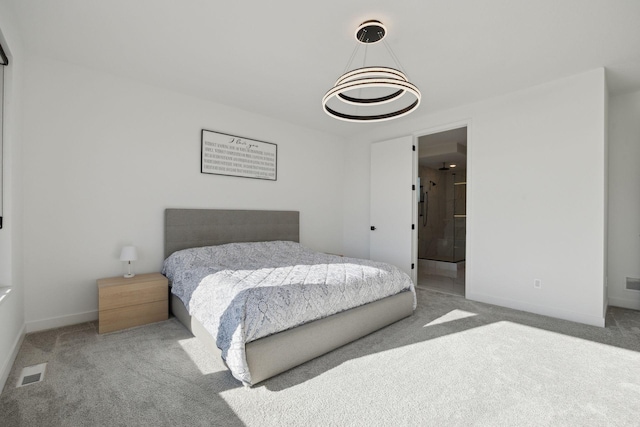 12745 Stutz Ct NE, Blaine, MN 55449 - carpeted bedroom with baseboards and a chandelier