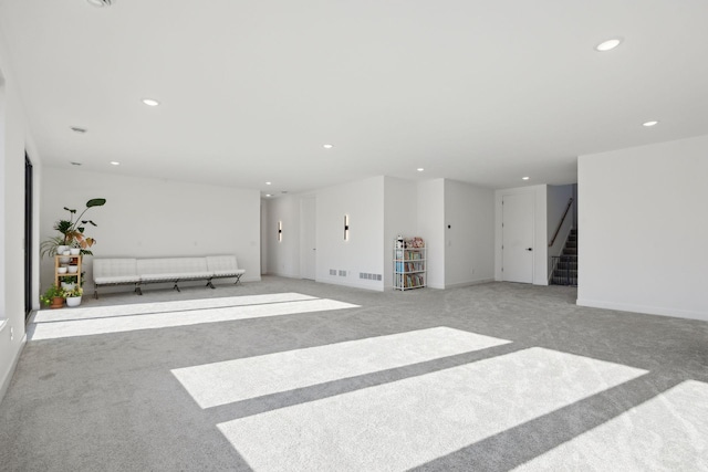 12745 Stutz Ct NE, Blaine, MN 55449 - unfurnished living room featuring recessed lighting, carpet flooring, stairway, and baseboards