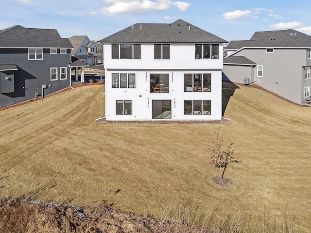 12745 Stutz Ct NE, Blaine, MN 55449 - rear view of house with a yard and a residential view