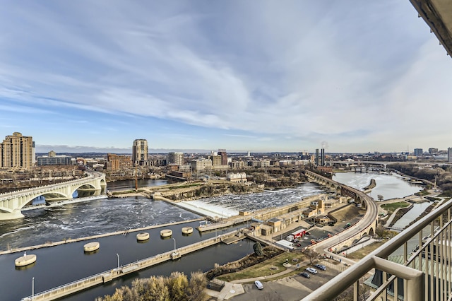 view of urban area featuring a notable bridge and a large body of water