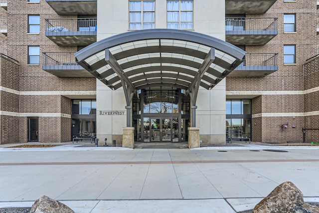 entrance to property with brick siding