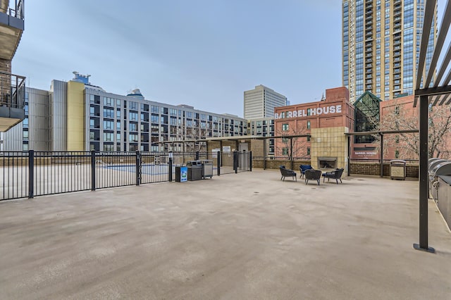 view of home's community featuring fence