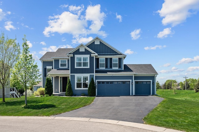 4118 San Vitero Ct, Victoria, MN 55318 - view of front facade with board and batten siding, asphalt driveway, a front yard, and an attached garage