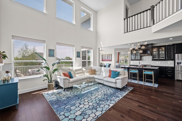4118 San Vitero Ct, Victoria, MN 55318 - living area with a high ceiling, dark wood finished floors, plenty of natural light, and baseboards
