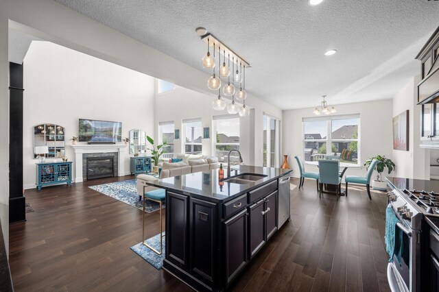 4118 San Vitero Ct, Victoria, MN 55318 - kitchen featuring a sink, appliances with stainless steel finishes, a chandelier, dark wood-type flooring, and open floor plan