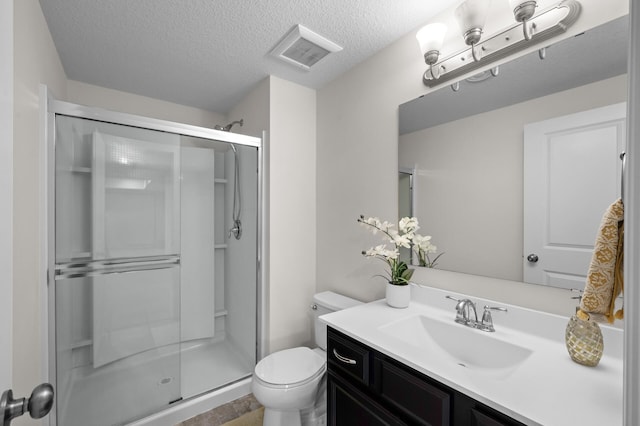 4118 San Vitero Ct, Victoria, MN 55318 - bathroom featuring a stall shower, toilet, vanity, and a textured ceiling