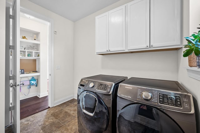 4118 San Vitero Ct, Victoria, MN 55318 - laundry room with washing machine and dryer, cabinet space, stone finish floors, and baseboards