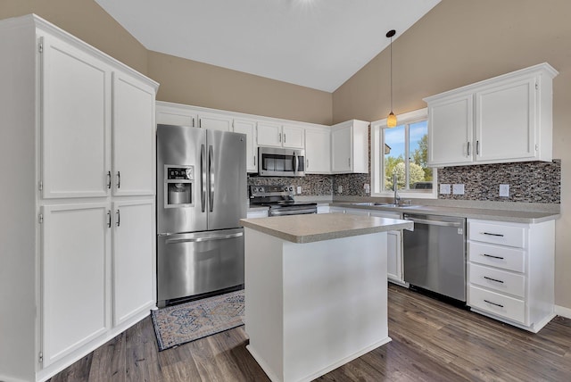 7320 Deer Pass Dr, Centerville, MN 55038 - kitchen with appliances with stainless steel finishes, dark wood-style floors, backsplash, white cabinets, and high vaulted ceiling