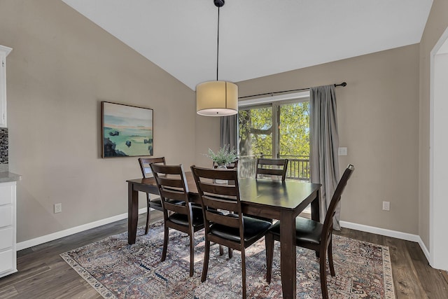 7320 Deer Pass Dr, Centerville, MN 55038 - dining room featuring dark wood finished floors, lofted ceiling, and baseboards