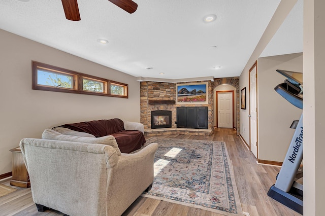 7320 Deer Pass Dr, Centerville, MN 55038 - living room with a ceiling fan, arched walkways, baseboards, light wood finished floors, and recessed lighting