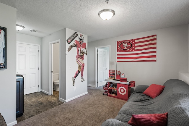 game room featuring carpet floors, a textured ceiling, and baseboards