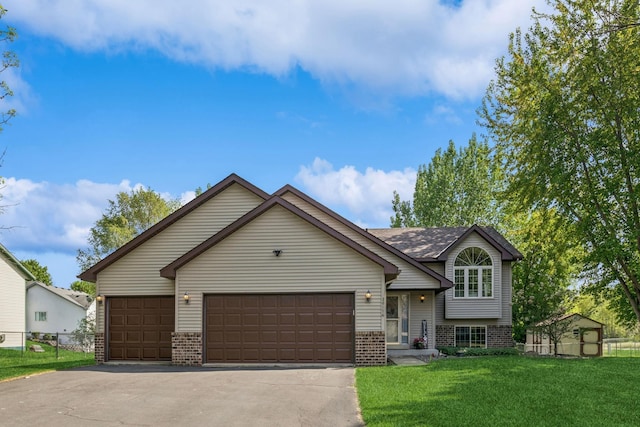 split level home featuring brick siding, driveway, and an attached garage