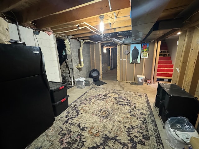 791 W Rd, Wright, MN 55798 - unfinished below grade area with freestanding refrigerator and stairway