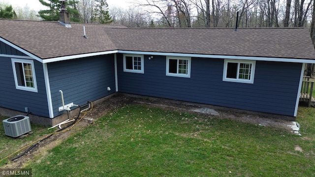 791 W Rd, Wright, MN 55798 - back of property with central AC unit, a shingled roof, a yard, and a chimney