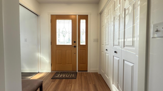 703 2nd St, Henning, MN 56551 - foyer entrance featuring wood finished floors and baseboards