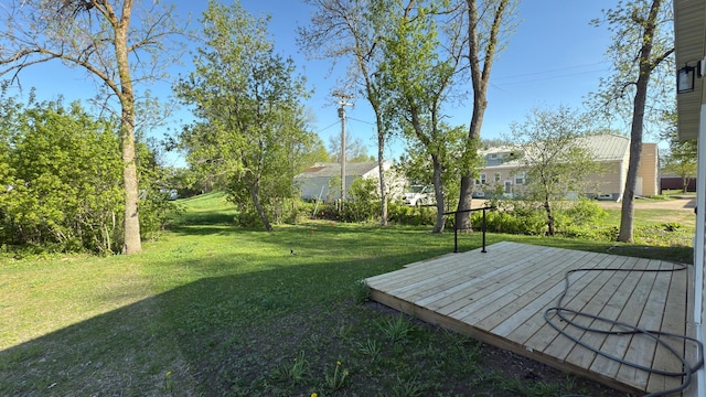 703 2nd St, Henning, MN 56551 - view of green lawn with a wooden deck