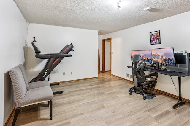 6012 Beard Ave N, Brooklyn Center, MN 55429 - office space featuring wood finished floors, baseboards, and a textured ceiling