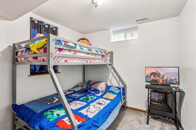 6012 Beard Ave N, Brooklyn Center, MN 55429 - bedroom featuring carpet flooring, a textured ceiling, and baseboards