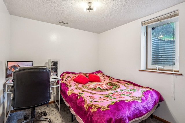 6012 Beard Ave N, Brooklyn Center, MN 55429 - bedroom with carpet floors and a textured ceiling