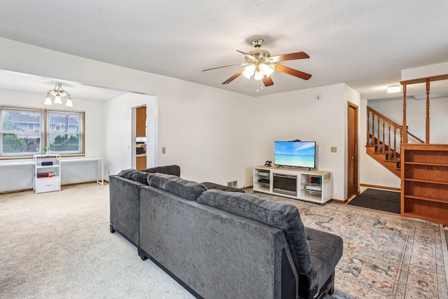 6012 Beard Ave N, Brooklyn Center, MN 55429 - carpeted living room featuring stairway, a ceiling fan, and a chandelier