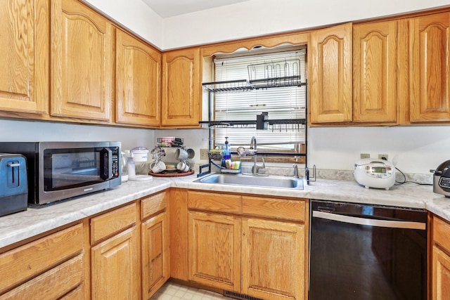 6012 Beard Ave N, Brooklyn Center, MN 55429 - kitchen with black dishwasher, a sink, stainless steel microwave, and light countertops