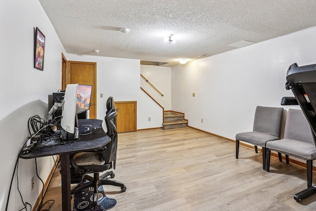 6012 Beard Ave N, Brooklyn Center, MN 55429 - office area featuring a textured ceiling, light wood-style flooring, and baseboards
