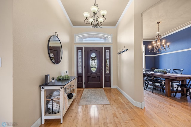 3914 21st Ave S, Moorhead, MN 56560 - foyer featuring a chandelier, ornamental molding, wood-type flooring, and baseboards