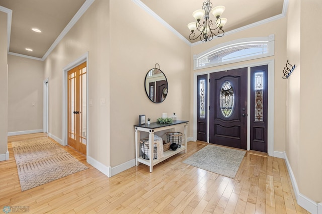3914 21st Ave S, Moorhead, MN 56560 - entryway with a chandelier, wood finished floors, baseboards, ornamental molding, and recessed lighting