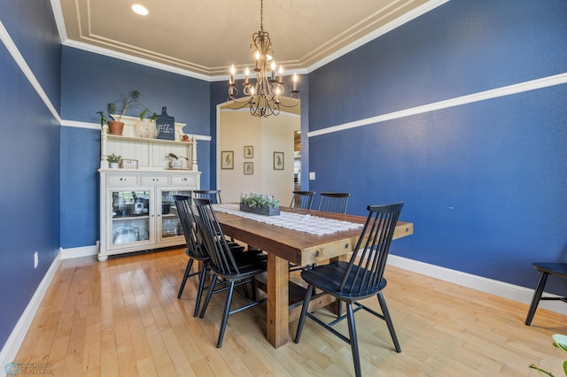 3914 21st Ave S, Moorhead, MN 56560 - dining area featuring a chandelier, light wood finished floors, baseboards, and ornamental molding
