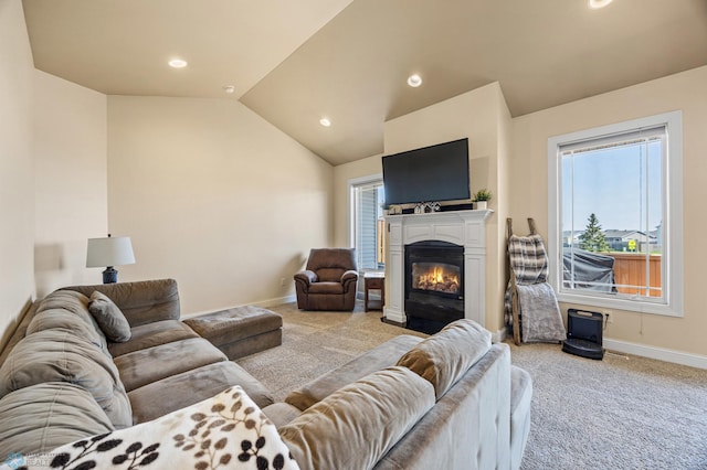 3914 21st Ave S, Moorhead, MN 56560 - living area featuring carpet flooring, baseboards, lofted ceiling, plenty of natural light, and a glass covered fireplace