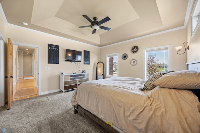 3914 21st Ave S, Moorhead, MN 56560 - carpeted bedroom featuring a raised ceiling, baseboards, ceiling fan, and ornamental molding
