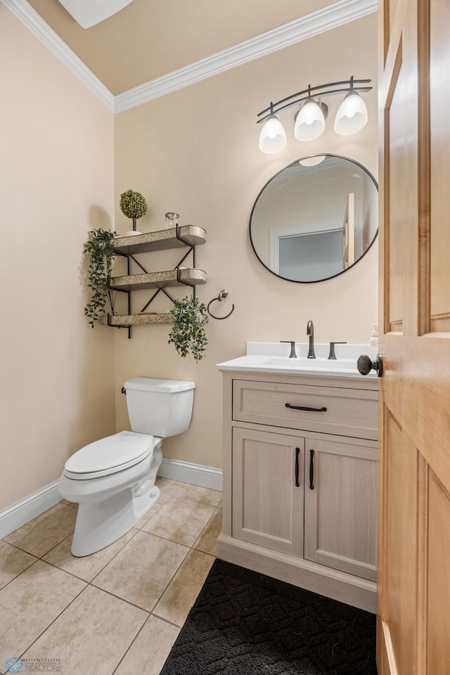 3914 21st Ave S, Moorhead, MN 56560 - half bathroom with ornamental molding, toilet, baseboards, tile patterned floors, and vanity