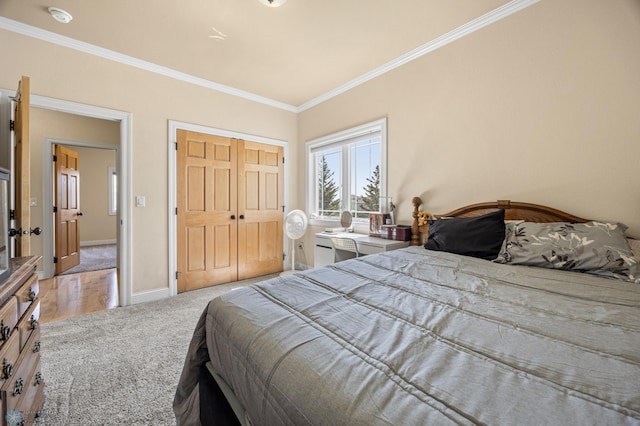 3914 21st Ave S, Moorhead, MN 56560 - carpeted bedroom featuring ornamental molding, a closet, and baseboards