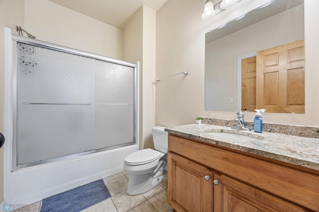 3914 21st Ave S, Moorhead, MN 56560 - full bath with tile patterned flooring, toilet, enclosed tub / shower combo, and vanity