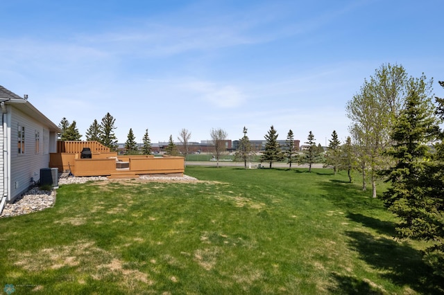 3914 21st Ave S, Moorhead, MN 56560 - view of green lawn featuring a wooden deck and central AC unit