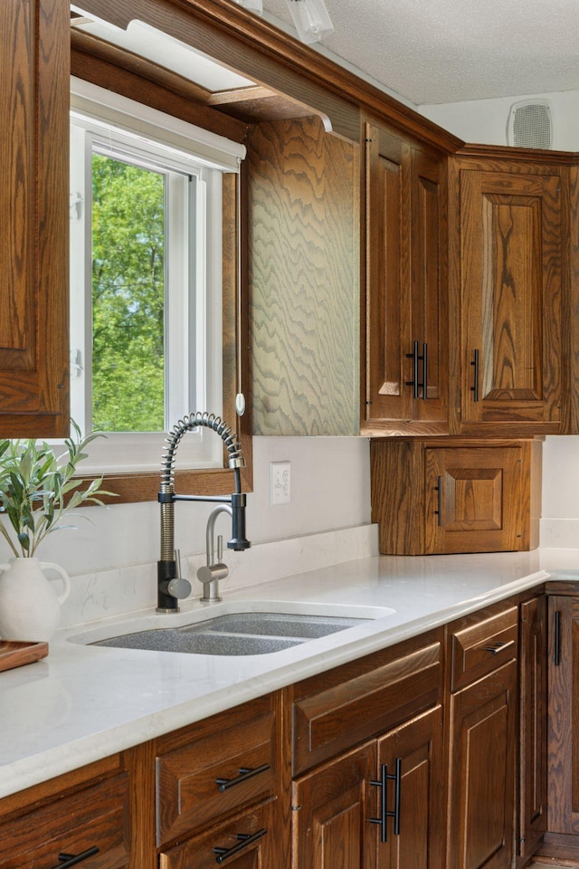 kitchen with a sink and light countertops