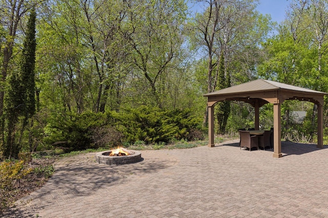 view of patio with a gazebo and an outdoor fire pit