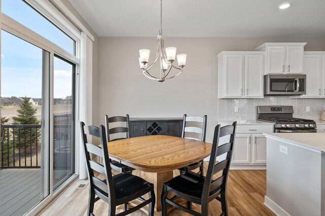 19000 72nd Pl N, Maple Grove, MN 55311 - dining room featuring a chandelier, light wood-type flooring, and recessed lighting
