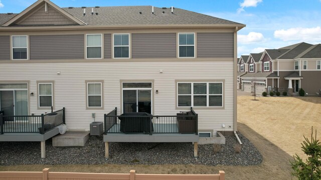 19000 72nd Pl N, Maple Grove, MN 55311 - rear view of house featuring a wooden deck and central air condition unit