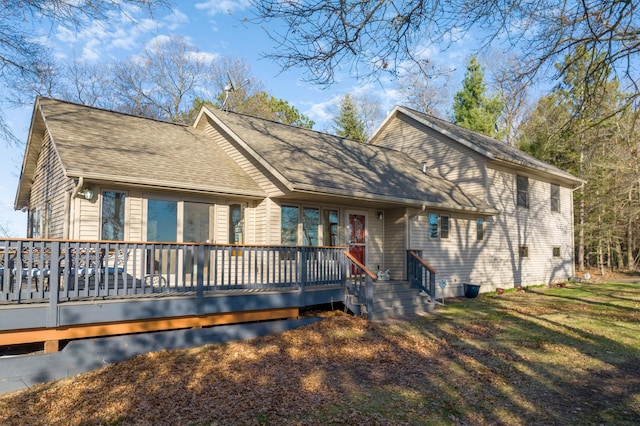 29825 Minerva Cir, Swiss Twp, WI 54830 - rear view of property featuring a wooden deck, roof with shingles, and a lawn