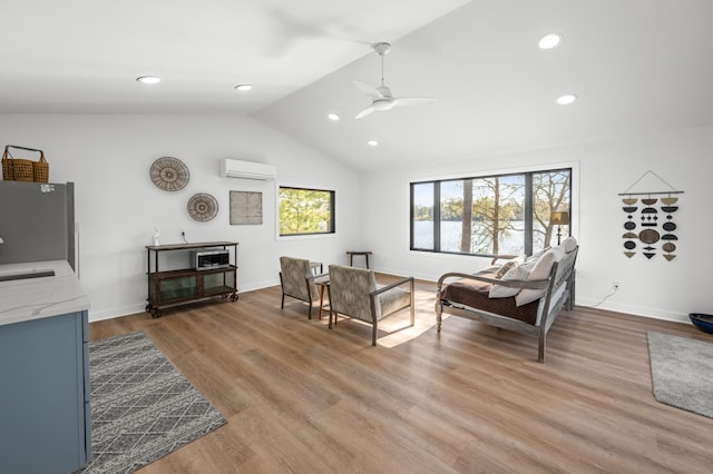 29825 Minerva Cir, Swiss Twp, WI 54830 - living room featuring an AC wall unit, a ceiling fan, lofted ceiling, recessed lighting, and light wood-style floors