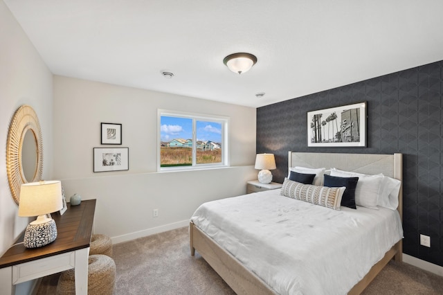 carpeted bedroom with baseboards