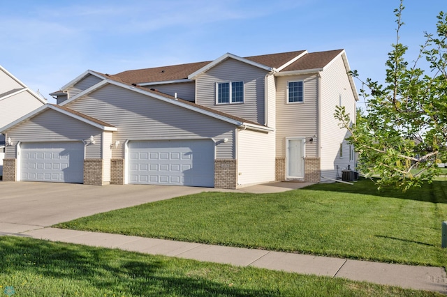 view of front of property with a garage, central air condition unit, brick siding, a front yard, and concrete driveway