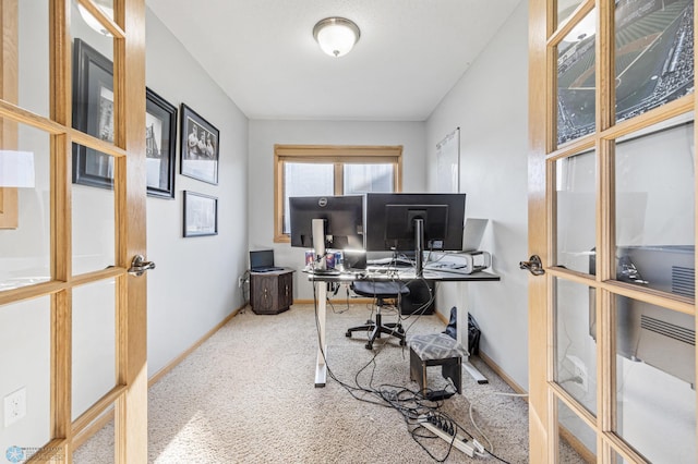 carpeted office space featuring baseboards